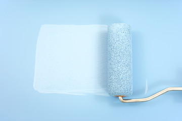 Paint roller and blue paint