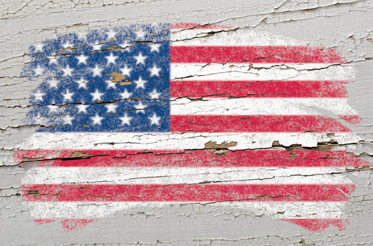 flag of USA on grunge wooden texture painted with chalk