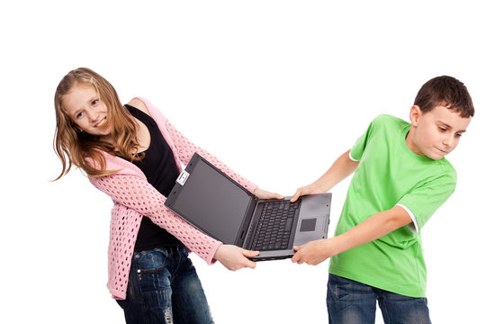 Children Fighting Over A Laptop