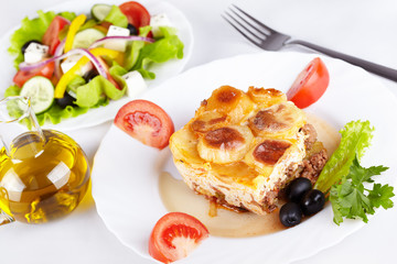Greek cuisine. Moussaka and greek salad