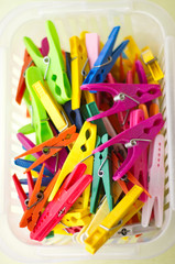 Colorful clothespins in the basket