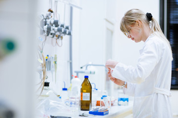 female researcher carrying out research experiments in a lab