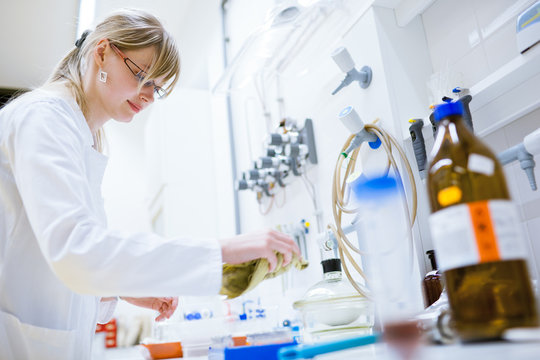 female researcher cleaning in a laboratory