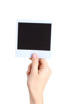 One photo paper in hand isolated on white