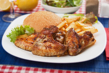 Grilled chicken wings with french fries