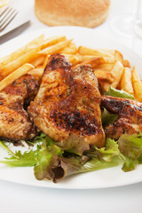Grilled chicken wings with french fries