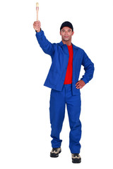 Painter showing a brush