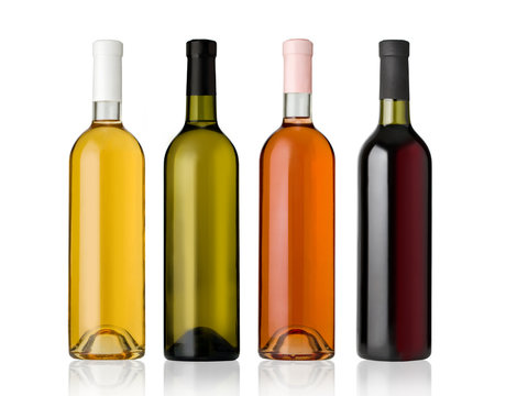 Set of white, rose, and red wine bottles.