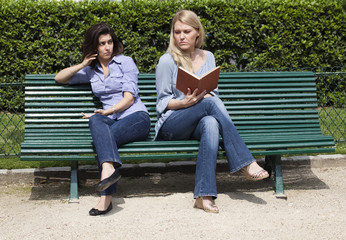 friends having a fight on a bench