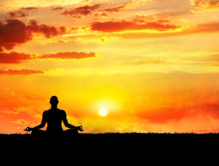 Fototapeta na wymiar Yoga meditation at sunset
