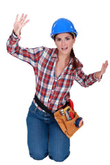 Female construction worker trapped in a small space