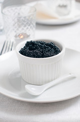 Fototapeta na wymiar Black caviar in a bowl