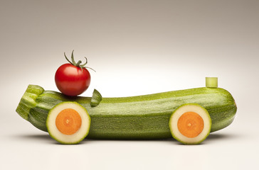 car made  with vegetables on white background