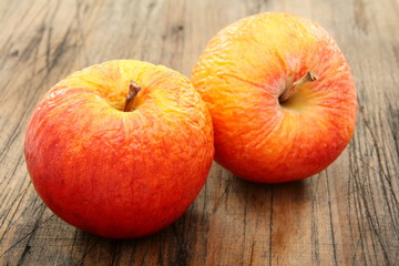 Two shriveled apples.