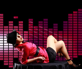 Sexy lady, lying on the table, on disco  background