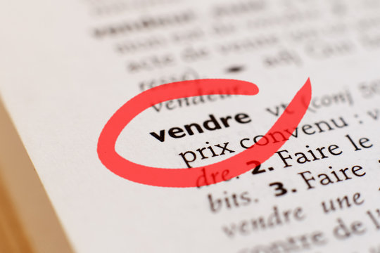 mot vendre entour&eacute; sur un dictionnaire