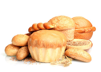 delicious round bread, buns and wheat isolated on white