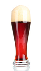 red beer with foam in glass isolated on white