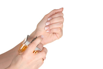 women's hands and bottle of perfume isolated on white