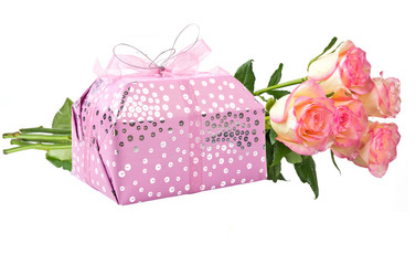 Gift and flowers isolated on white