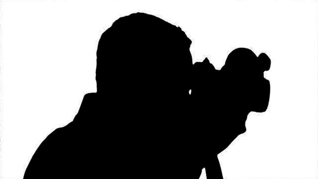 Photographer Silhouette close-up - black on white