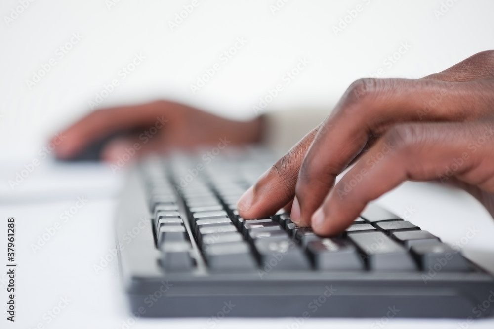 Poster close up of a masculine hand using a keyboard