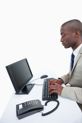 Fototapeta na wymiar Portrait of a businessman using a computer