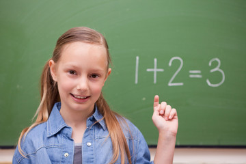 Schoolgirl raising her hand