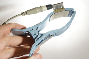 Limb ECG electrode with patient cable held in left hand