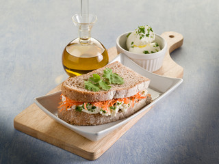 healthy sandwich with carrot cheese and parsley