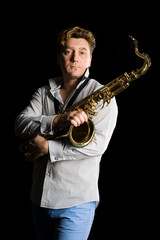 Fototapeta premium Portrait of a young saxophonist