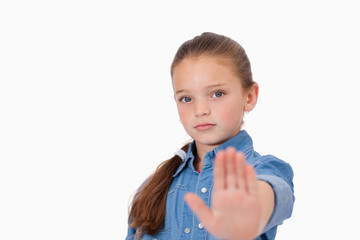 Girl saying stop with her hand