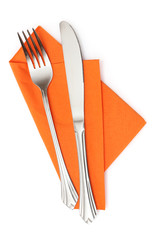Fork and knife in a orange cloth isolated on white