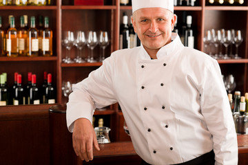 Fototapeta na wymiar Chef cook confident professional posing restaurant