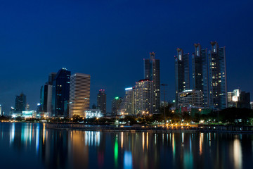Bangkok city at night with reflection of skyline