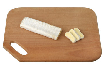 sliced ??brie cheese on a wooden cutting board