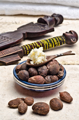 Shea nuts and butter in a spoon