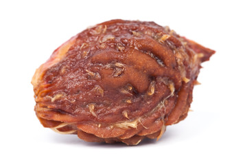 Closeup of peach fruit stone isolated on white background