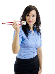 Fototapeta premium girl with chopsticks and sushi. Isolated on white