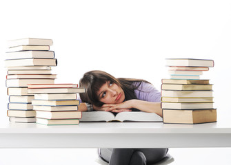 Tired of studies, young Woman on her desk with books, similar pi