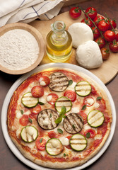 still life with pizza and ingredients