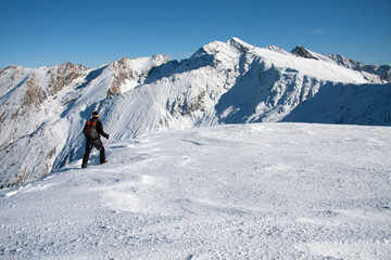 Fototapeta na wymiar Boy trekking in the mountains, winter