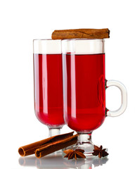 mulled wine in the glasses, cinnamon and anise isolated on white