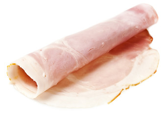 rolled slice of ham isolated