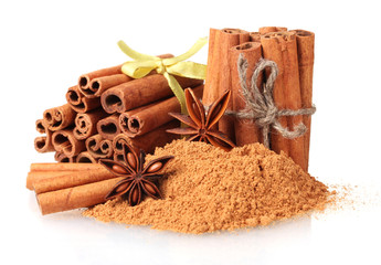Cinnamon sticks, powder and anise isolated on white
