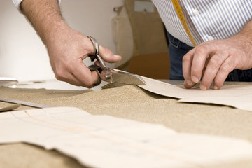 detail of tailor's hand with scissors