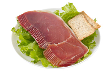 prosciutto with toasts on the plate
