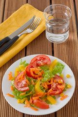 vegetable salad with glass of water