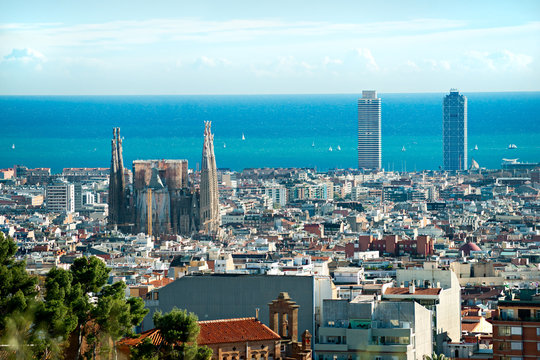 View of Sagrada Familia and port from Park Guell. Barcelona, Spa