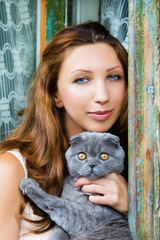 Portrait of girl with a pedigree cat